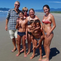 Monica with her kids on the eastern beach of Bertioga